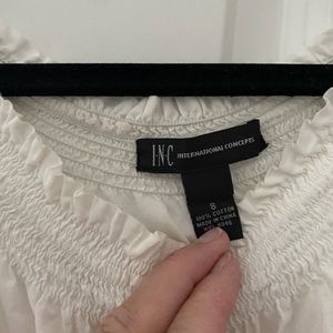 Woman’s white INC blouse size 8.